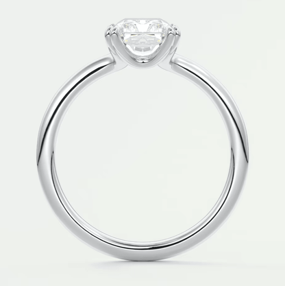 Silver solitaire diamond engagement ring with a princess cut gemstone.