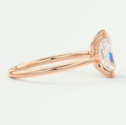 18k rose gold engagement ring with a marquise-cut diamond.