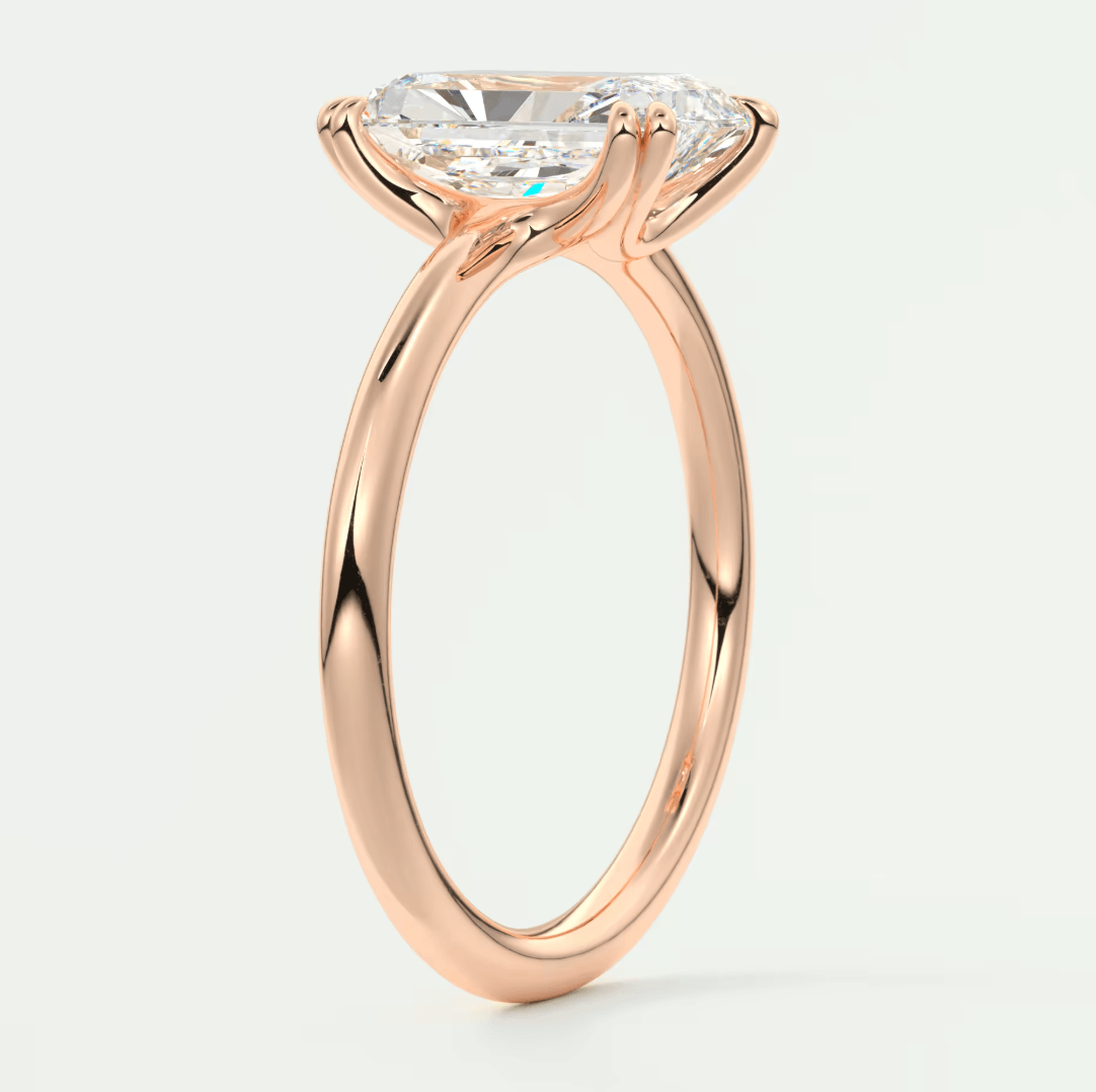 18-karat rose gold engagement ring with a cushion-cut diamond.