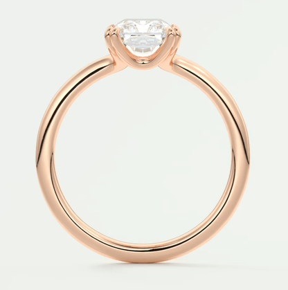 Rose gold engagement ring with a princess cut diamond.