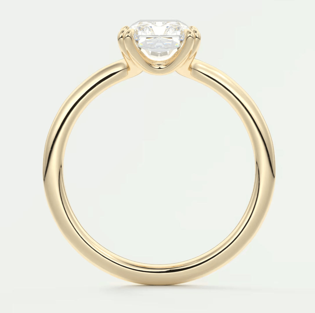 18-karat yellow gold engagement ring with a princess-cut diamond.