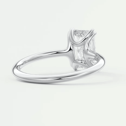 White gold princess cut diamond engagement ring with baguette side stones and a sleek band.