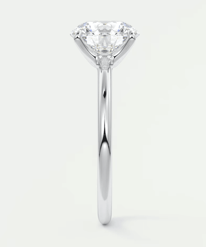 18-karat white gold solitaire diamond engagement ring with a round brilliant cut.