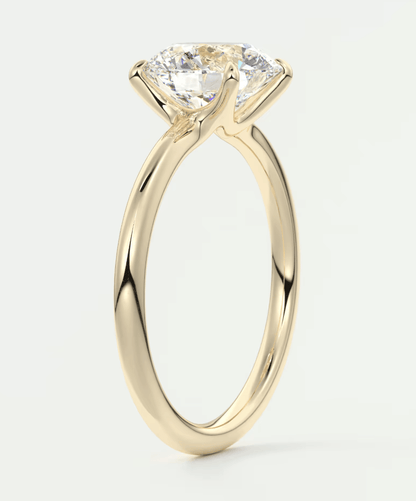 18k yellow gold solitaire diamond engagement ring with a twisted band design.
