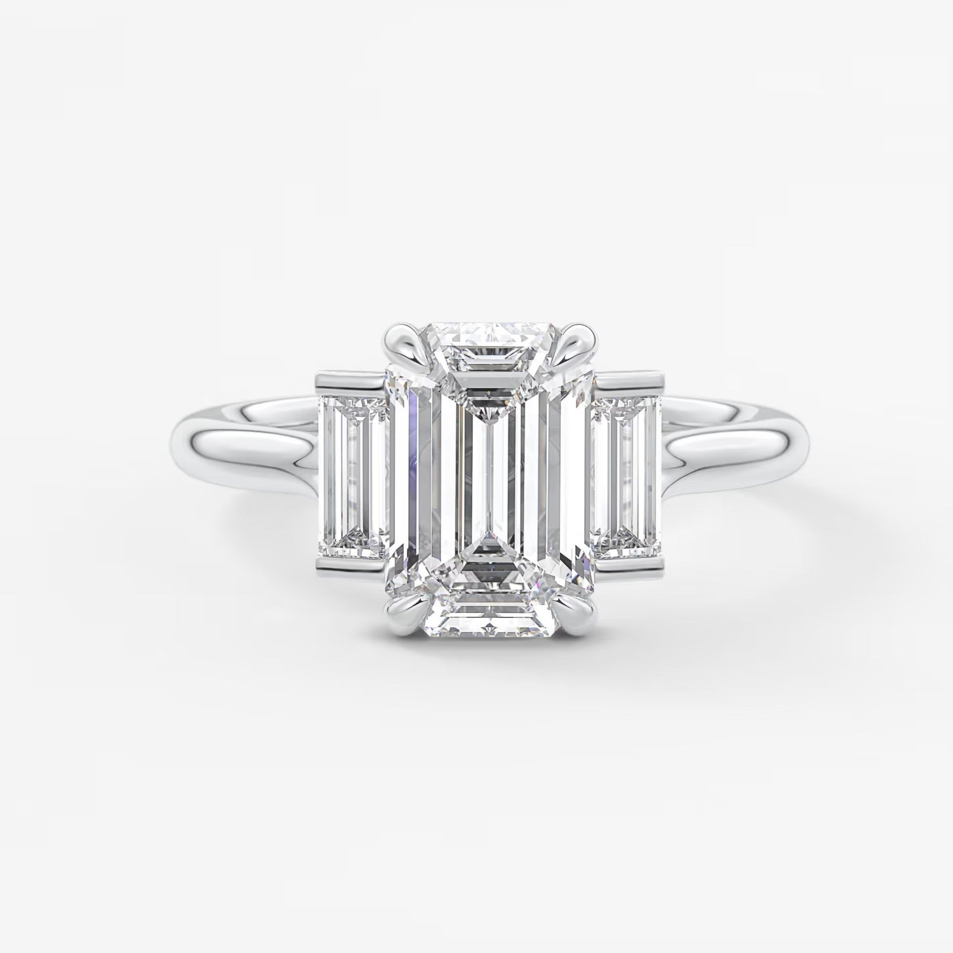 Aureline emerald baguette trilogy engagement ring