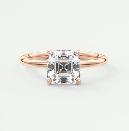 18k rose gold engagement ring with a princess cut diamond.