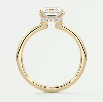 18k yellow gold emerald cut diamond engagement ring.