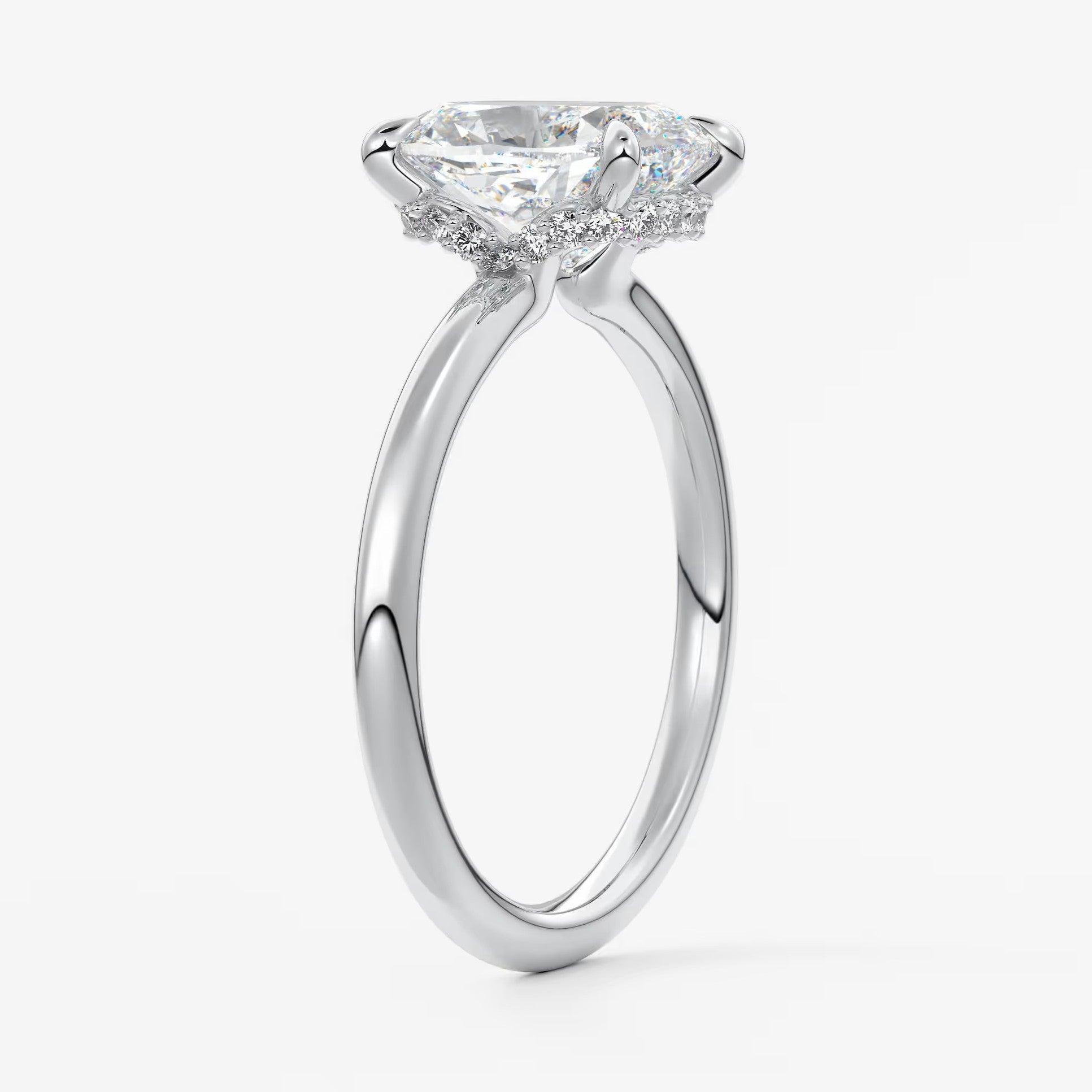 Aurora elongated cushion hidden halo engagement ring