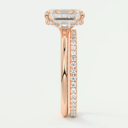 18k rose gold emerald cut diamond engagement ring with a matching band.