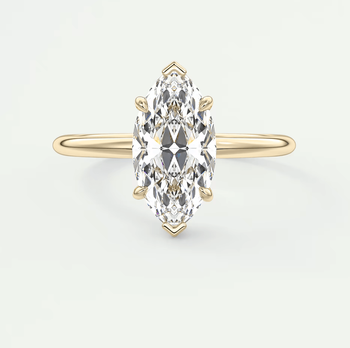18k yellow gold marquise diamond engagement ring with a classic solitaire design.