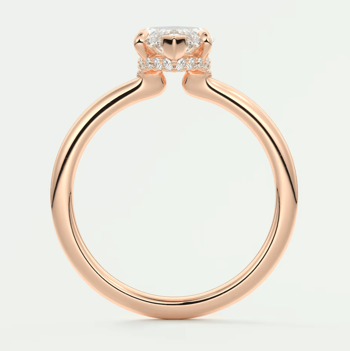 Rose gold engagement ring with a princess cut diamond and small side diamonds, featuring an elegant design.