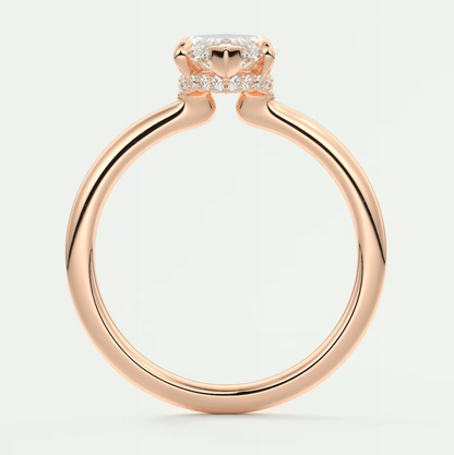 Rose gold engagement ring with a princess cut diamond and small side diamonds, featuring an elegant design.