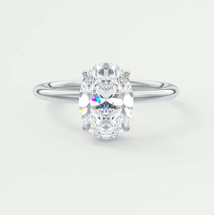 Silver skull ring with clear gemstone
