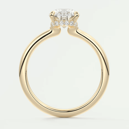 18-karat yellow gold engagement ring with a cushion-cut diamond and small round diamonds on the band.
