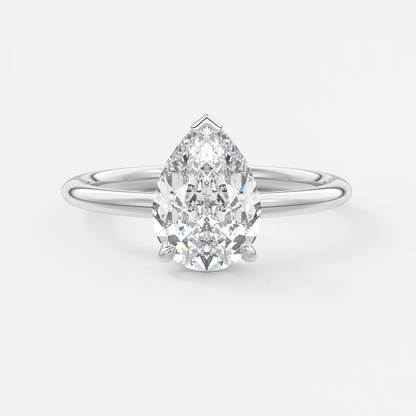 Pear-shaped diamond engagement ring with white gold band, featuring a classic solitaire design.