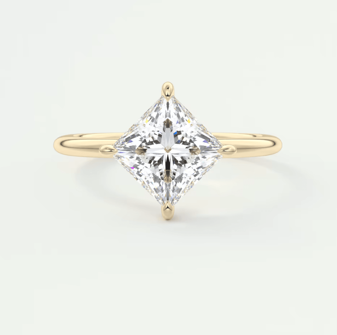 18k yellow gold princess cut diamond engagement ring.