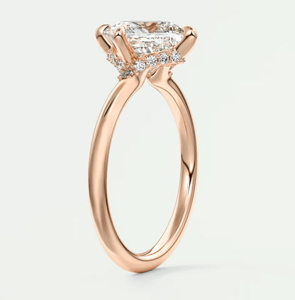 18k rose gold princess cut diamond engagement ring with halo detailing.
