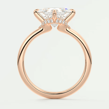 18-karat rose gold engagement ring with a princess-cut diamond.