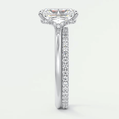 18-karat white gold engagement ring with a princess-cut diamond and pave-set diamonds on the band.