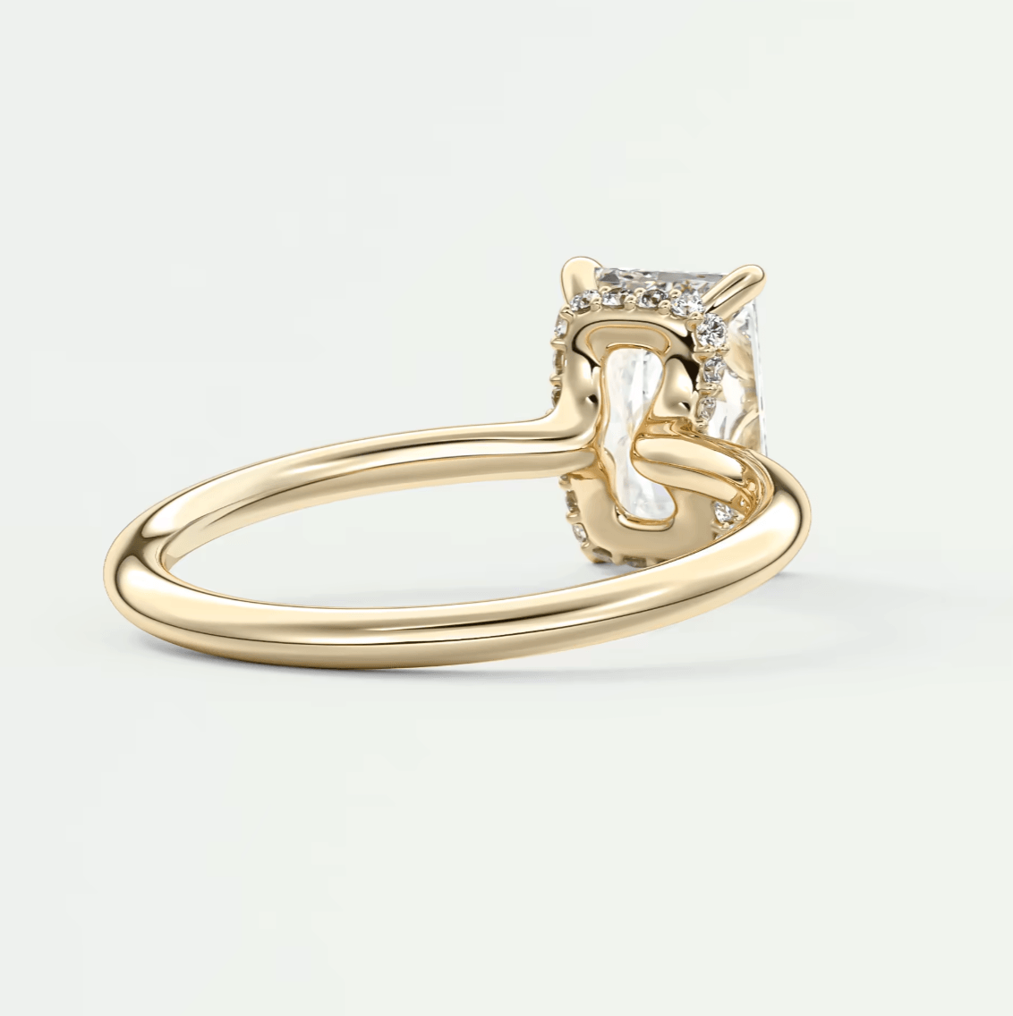 18k yellow gold engagement ring with princess cut diamond and small side diamonds.
