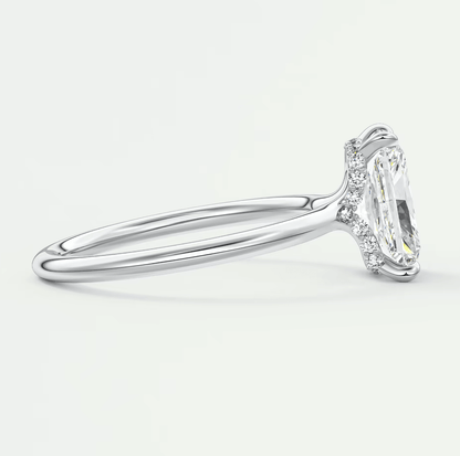 18k white gold engagement ring with marquise-cut diamond and halo design.