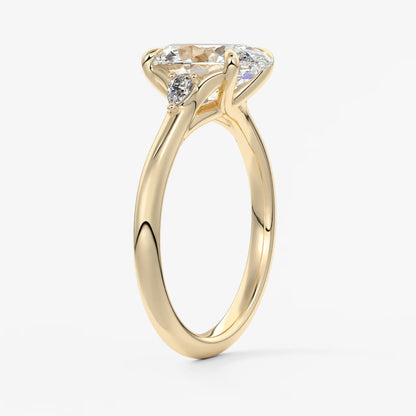 Cassia – oval trilogy with pear side stones