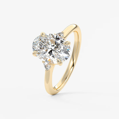 Cassia – oval trilogy with pear side stones