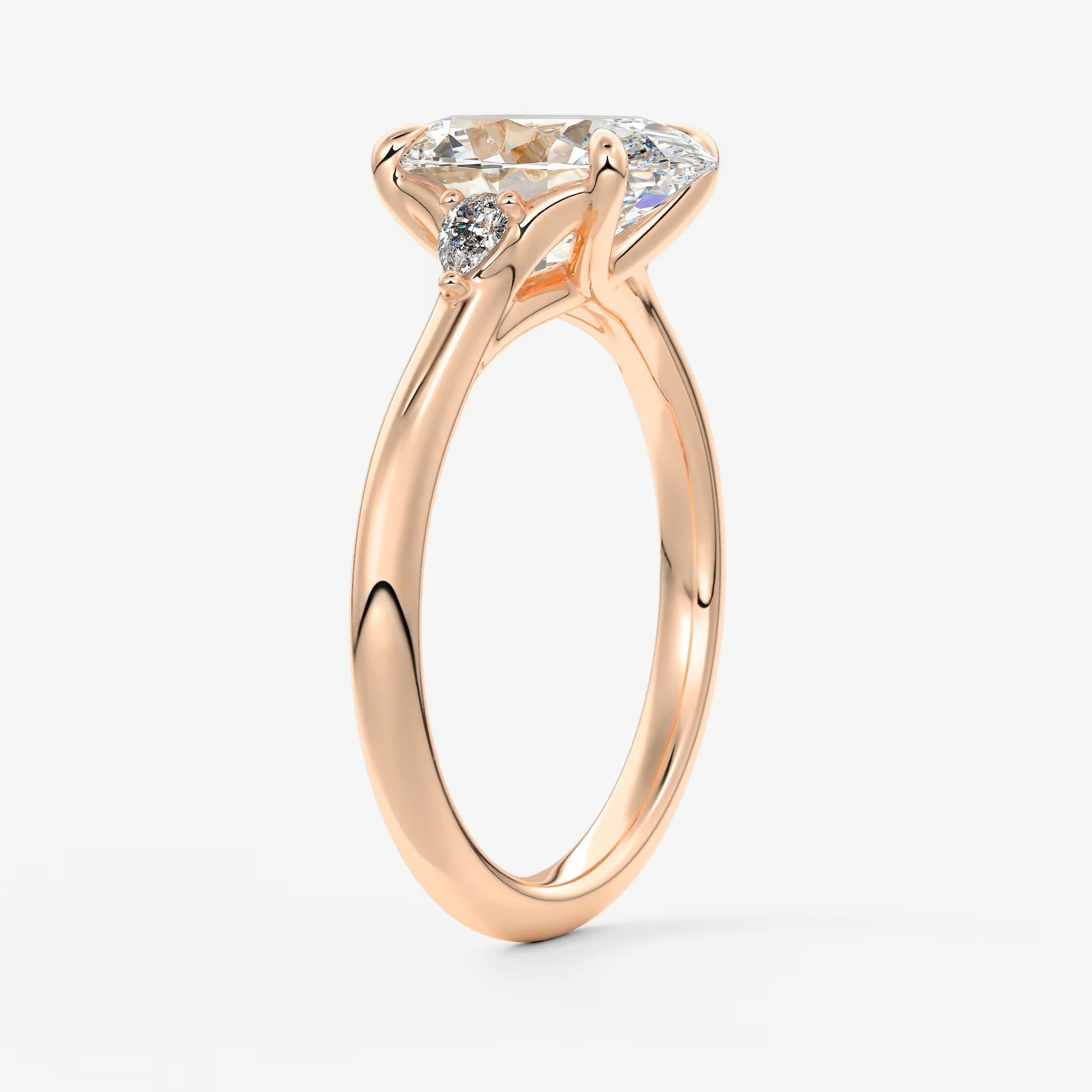 Cassia – oval trilogy with pear side stones