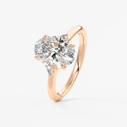 Cassia – oval trilogy with pear side stones