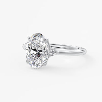 Cassia – oval trilogy with pear side stones