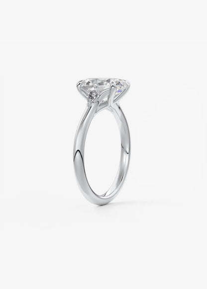 Cassia – oval trilogy with pear side stones
