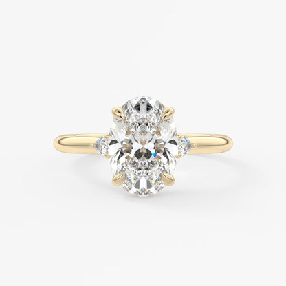 Cassia – oval trilogy with pear side stones