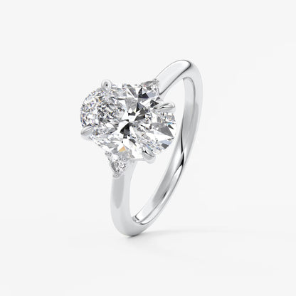 Cassia – oval trilogy with pear side stones