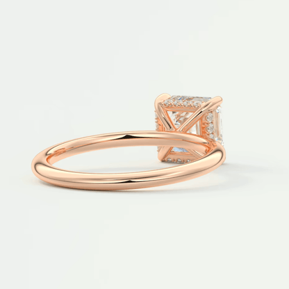 Rose gold princess cut diamond engagement ring with a delicate band design.