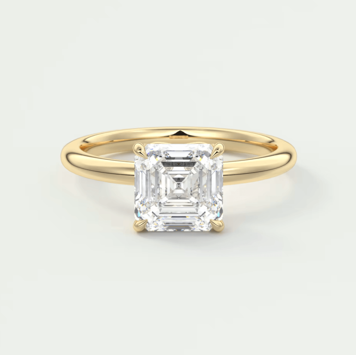 18k yellow gold engagement ring with an asscher-cut diamond.