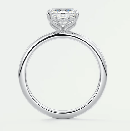 18-karat white gold solitaire engagement ring with a princess-cut diamond.