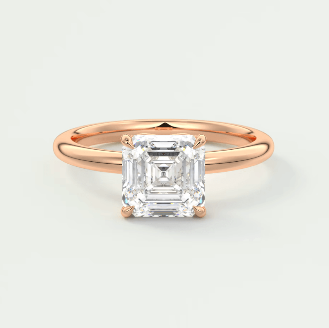 18-karat rose gold engagement ring with an asscher-cut diamond.