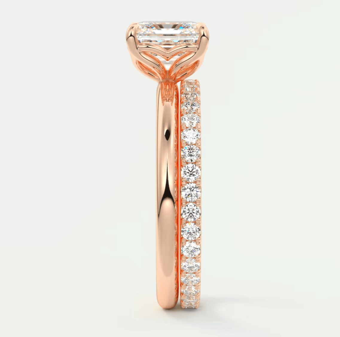 18-karat rose gold engagement ring with a princess-cut diamond and pavé set diamonds on the band.