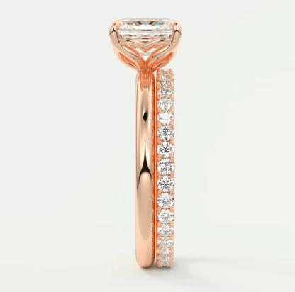 18-karat rose gold engagement ring with a princess-cut diamond and pavé set diamonds on the band.
