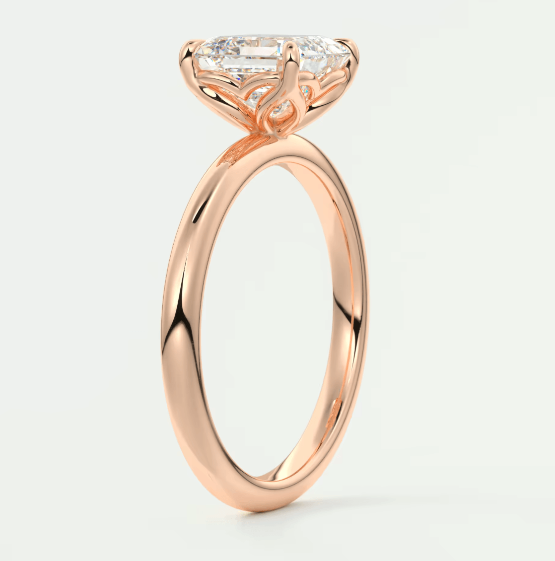 18k rose gold engagement ring with a princess cut diamond.