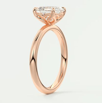 18k rose gold engagement ring with a princess cut diamond.
