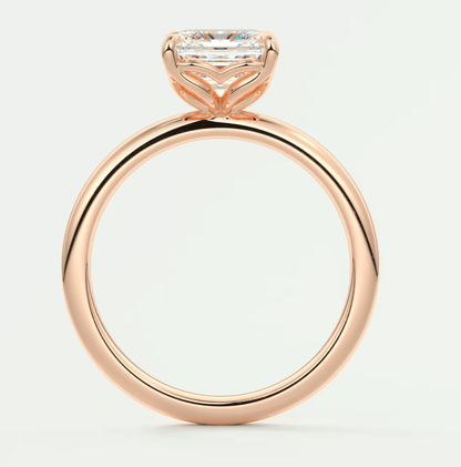 18-karat rose gold engagement ring with a princess-cut diamond.