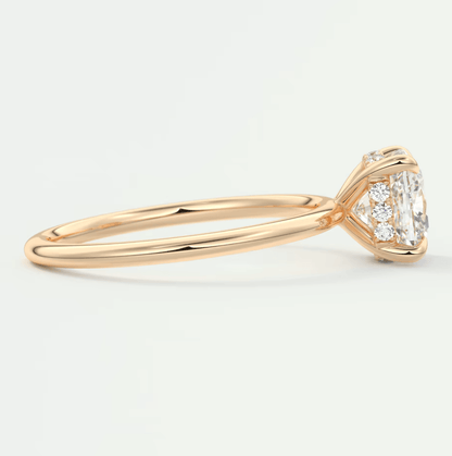 18k rose gold engagement ring with a princess cut diamond and halo design.