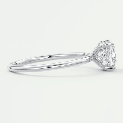 18k white gold engagement ring with a princess cut diamond and halo setting.