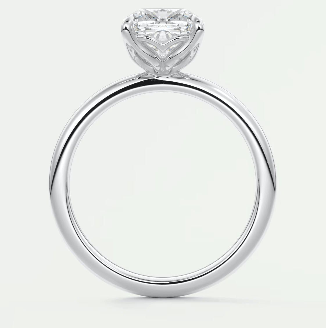 18-karat white gold engagement ring with a heart-shaped diamond.