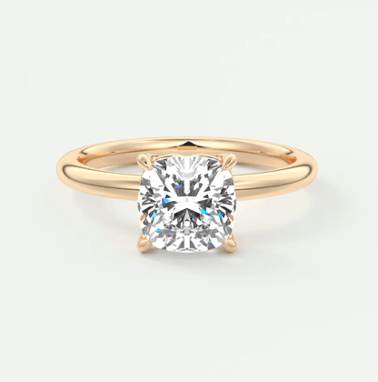 18k rose gold cushion-cut diamond engagement ring.