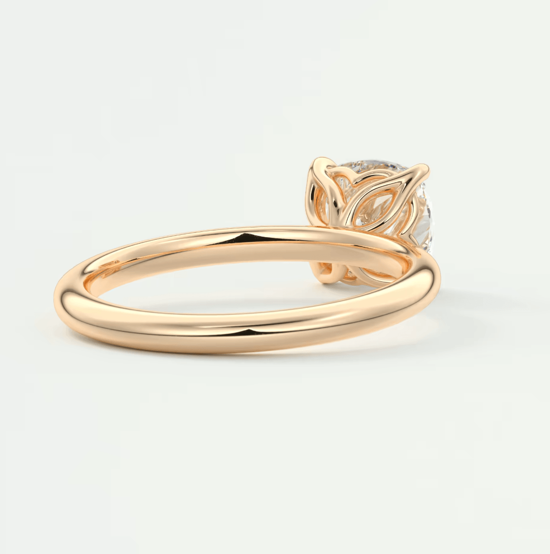 18k gold diamond engagement ring with leaf design.