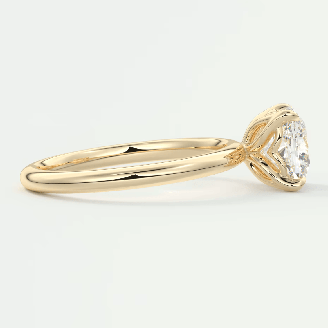 18-karat yellow gold solitaire diamond engagement ring.