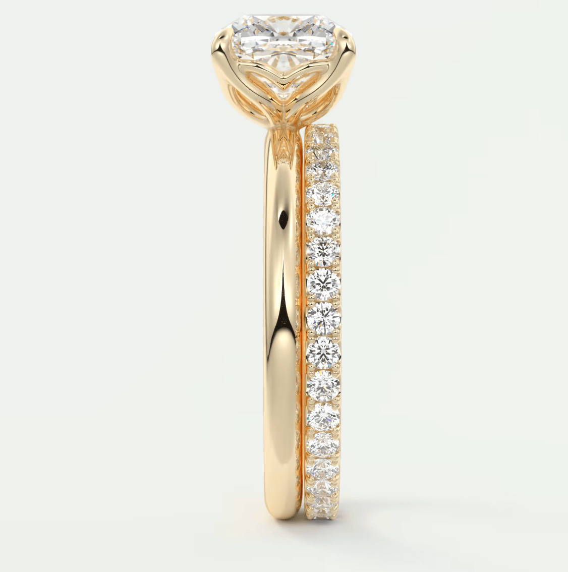 18k yellow gold engagement ring with a round diamond center and channel-set diamonds on the band.