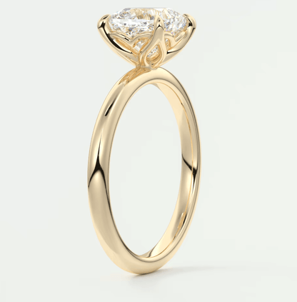 18-karat yellow gold engagement ring with a princess-cut diamond.